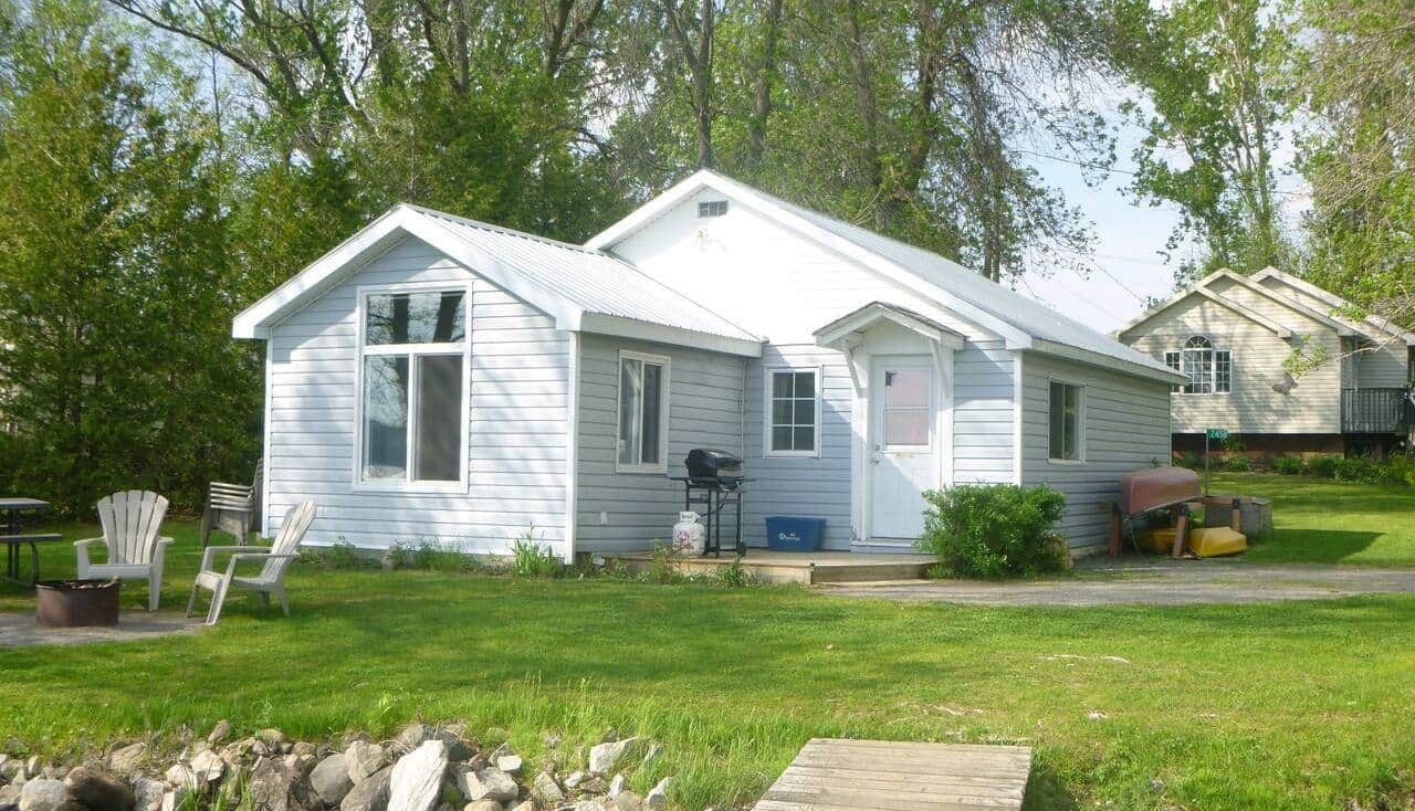 Lakefront cottage near Ottawa in White Lake, Ontario with private dock and waterfront yard