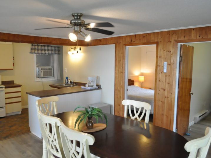 Dining area and kitchen view inside The Cove 245B cottage at White Lake near Ottawa.