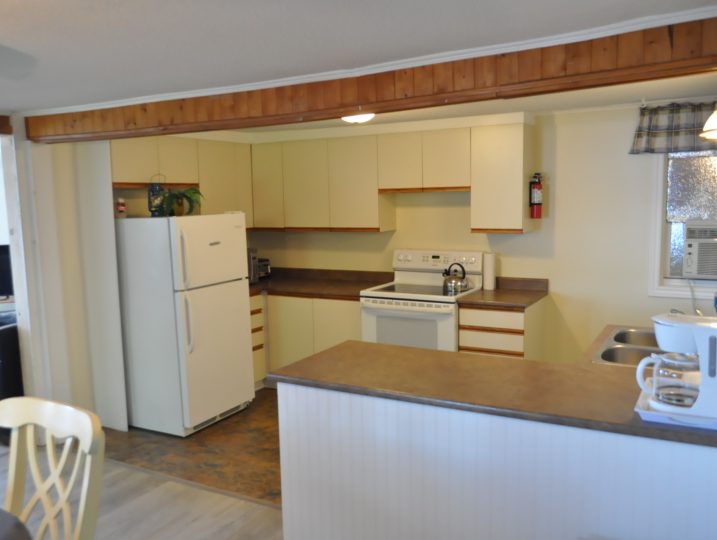 Fully equipped kitchen inside The Cove 245B 2-bedroom cottage at White Lake.