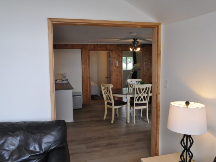 Open concept living and dining space inside The Cove 245B cottage rental.