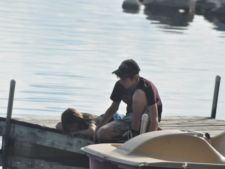 Guests enjoying the dock area on White Lake at Diamond Valley Cottages.