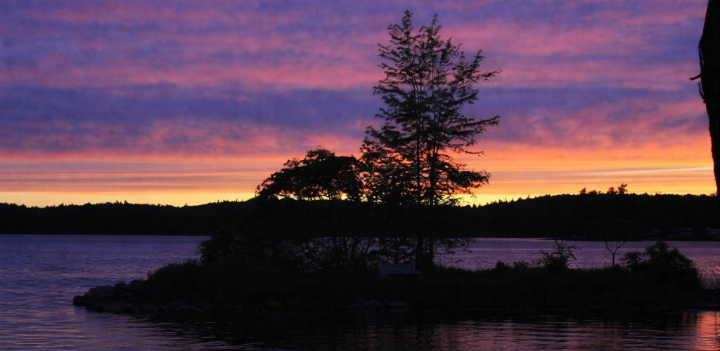Sunset over White Lake at The Cove lakefront cottage near Ottawa, Ontario